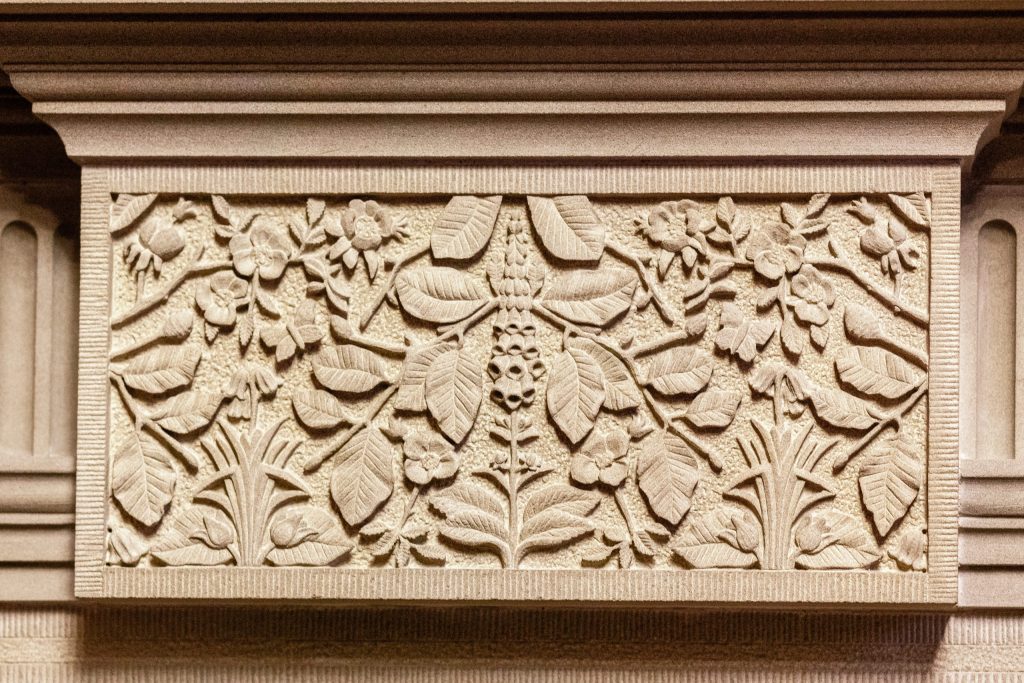 Ornate stone carving of leaves and flowers