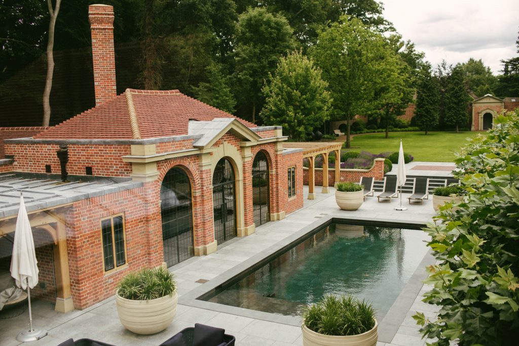 Classical brick garden pool house