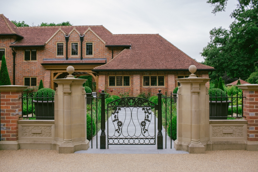 Entrance to courtyard garden with ornate metal gate