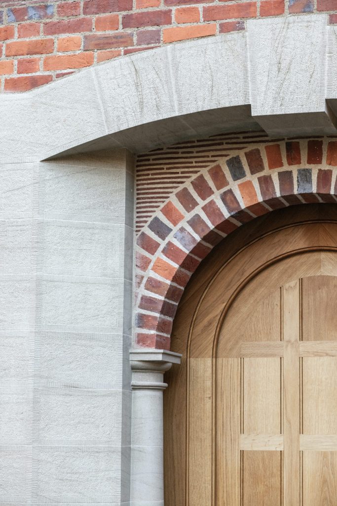 Arts and Crafts Oak front door with stone and brick arch