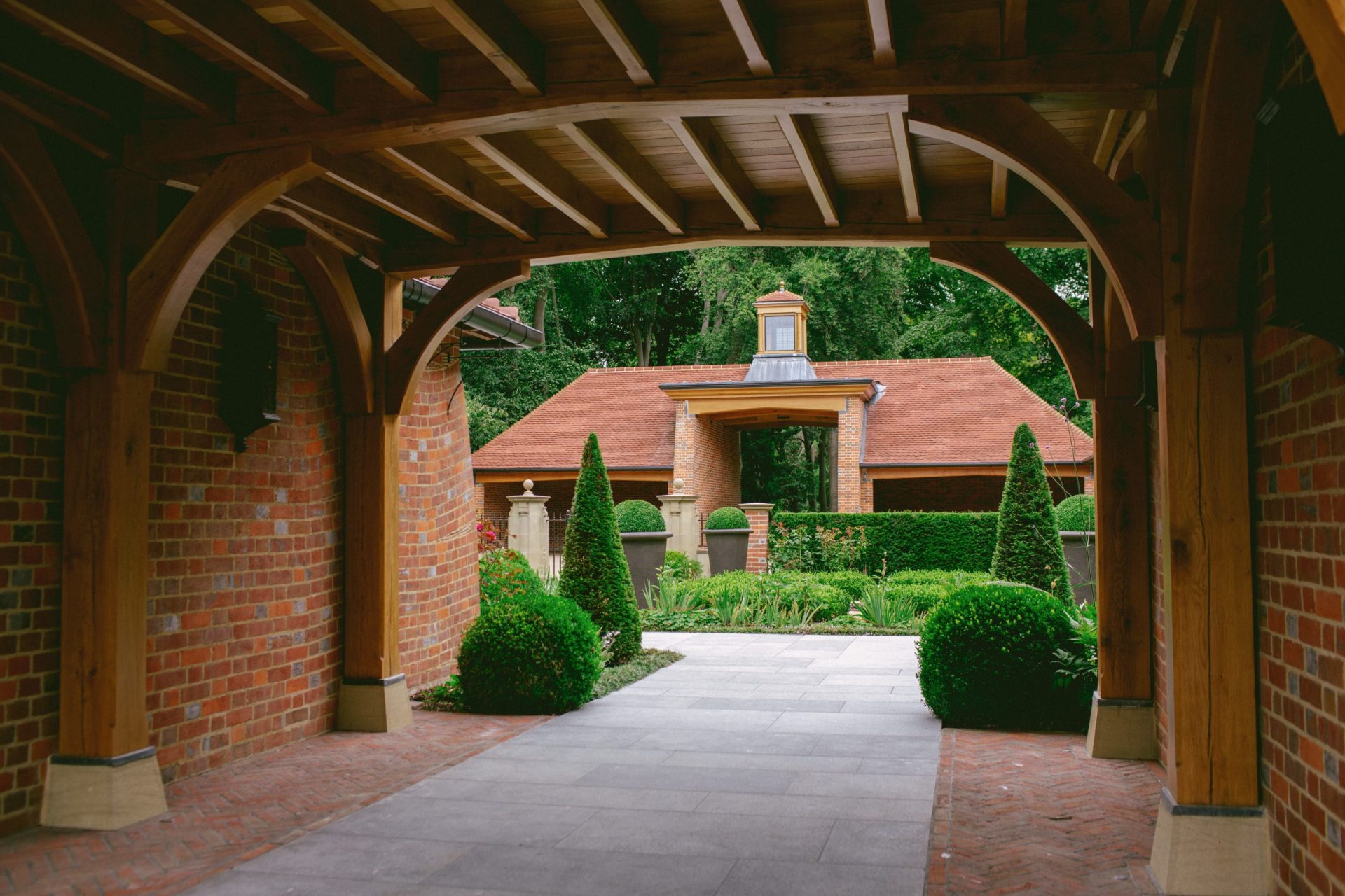 Estate gatehouse with large cartway and brick buttresses