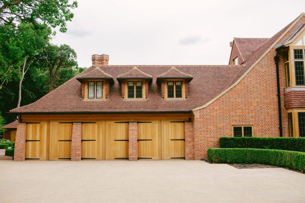 Arts and Crafts brick and Oak garage wing