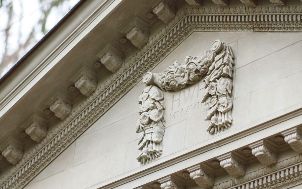 Carved Stone Cartouche with Leaves in a Swag Carved stone leaves and flowers in a swag