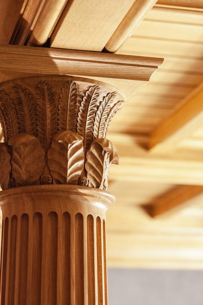 Ornate carved Oak column capital with leaves