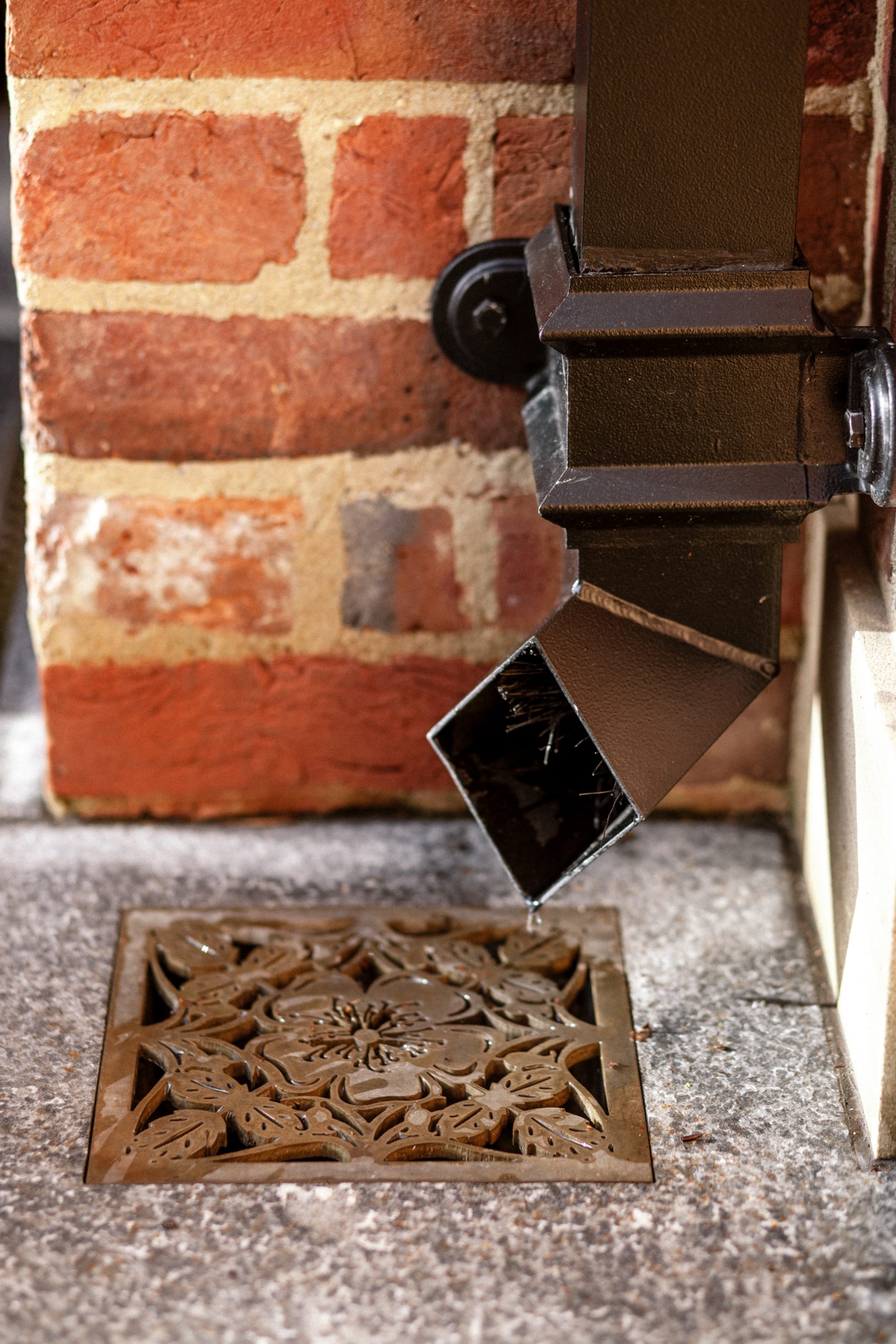 Intricate brass metal floor grate inlay