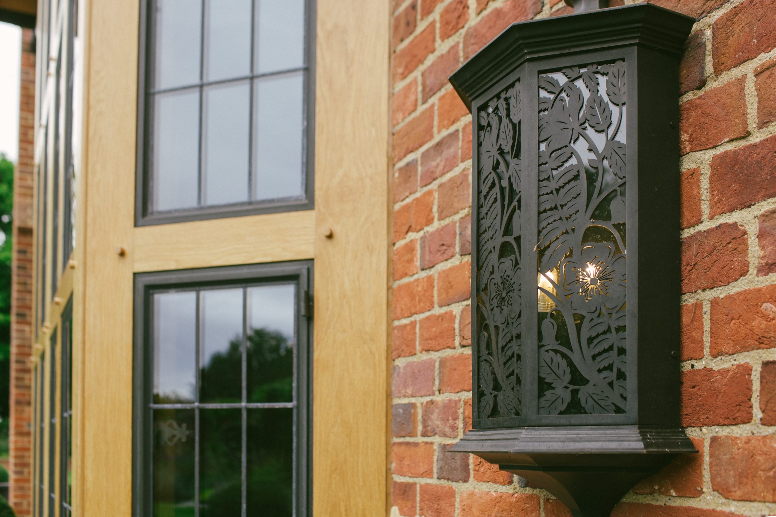 Bespoke garden wall lights in metal and glass