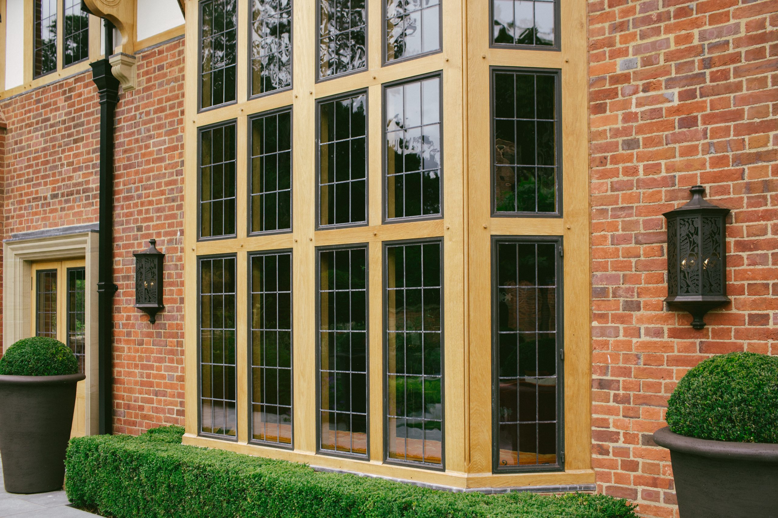 Bronze casement windows in large Oak bay window