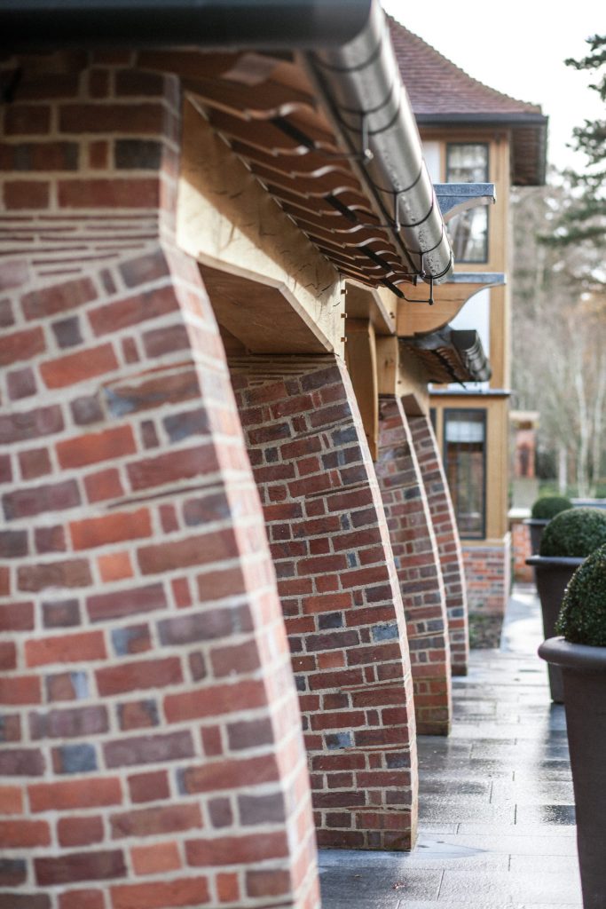 Arts and Crafts English house with brick buttresses