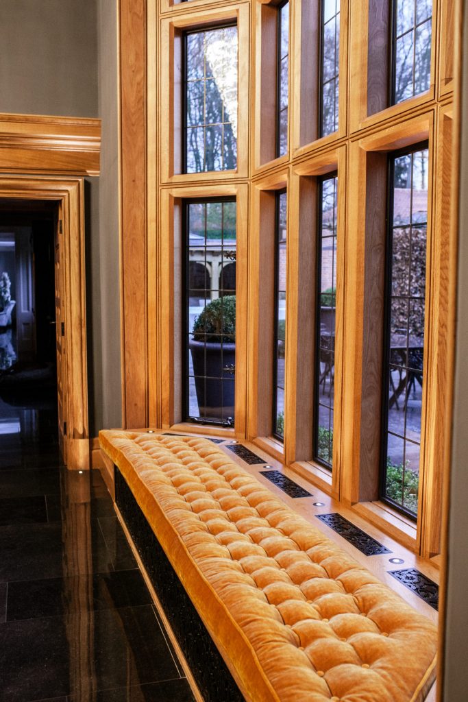 South facing double height Oak window Double height tall Oak bay window with bronze casements