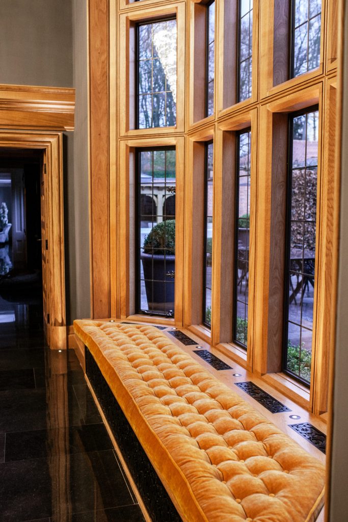 Double height tall Oak bay window with bronze casements