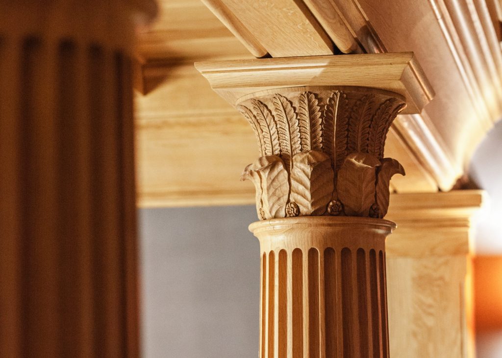 Carved Oak column capital with fluted column Carved wood column capital with leaves and flowers