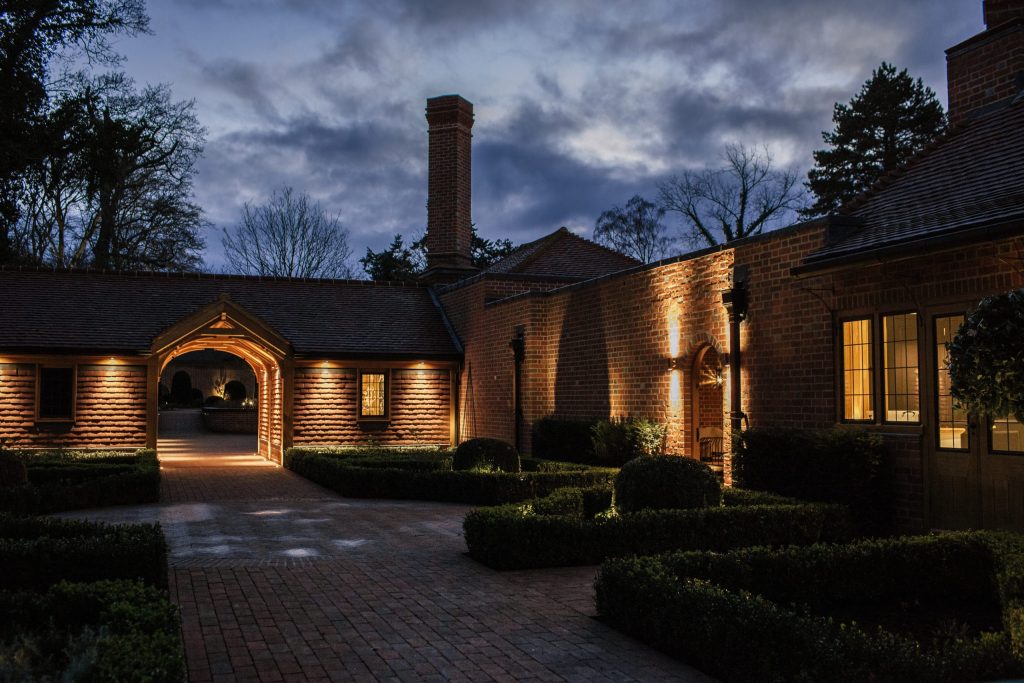 Arts and Crafts architectural style courtyard at night