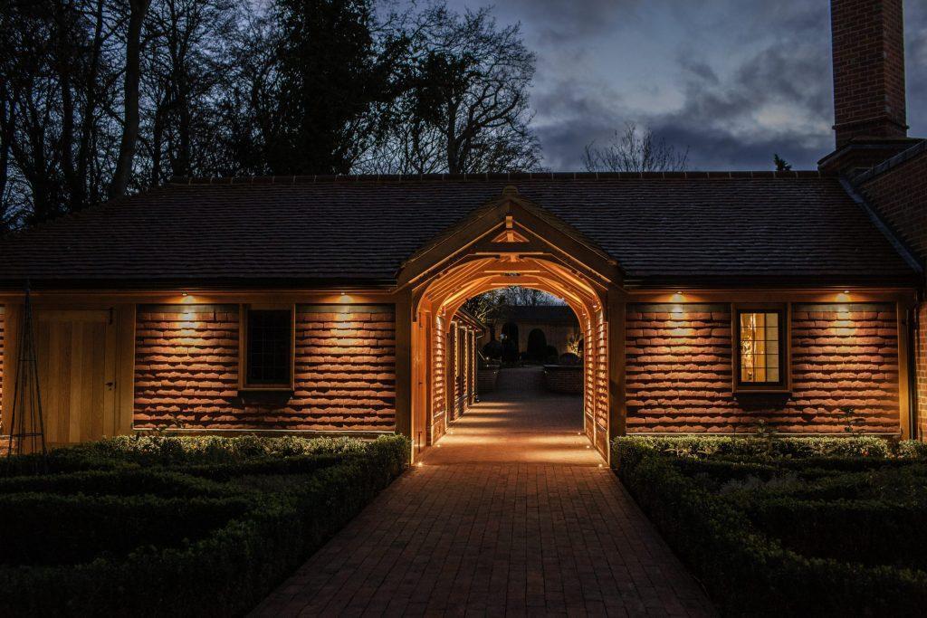 Oak framed walkway through outbuildings Feature Oak framed ceiling to garden building walkway