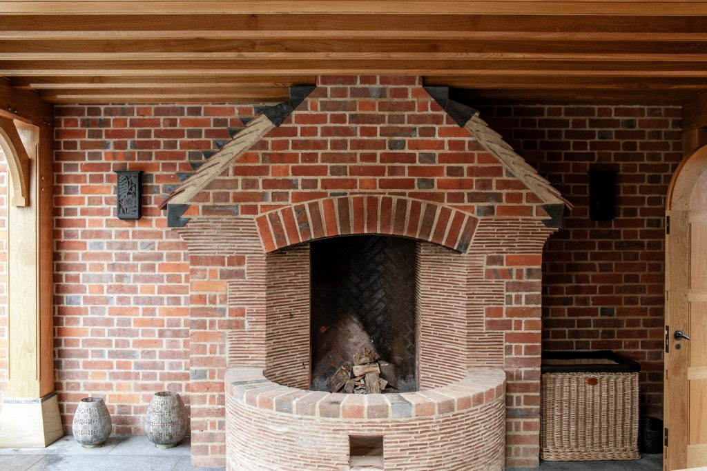 Brick and tile large outdoor garden fireplace and fire pit