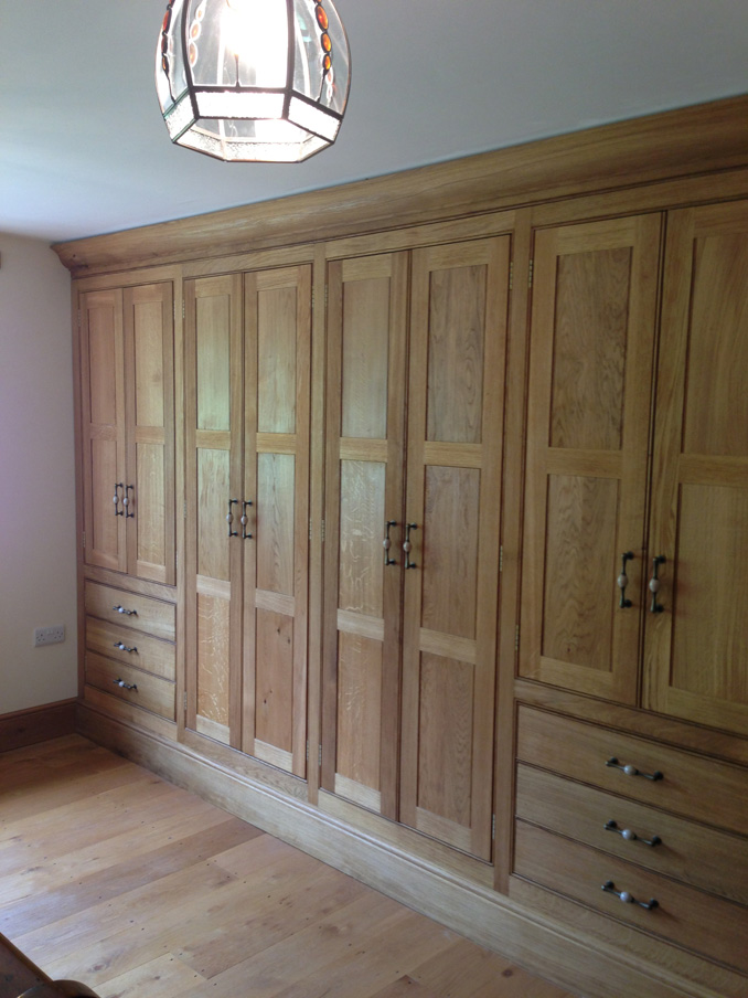 Bespoke Oak fitted wardrobes in master bedroom