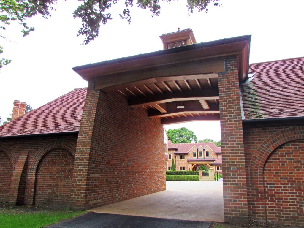 Oak and brick entrance gatehouse to country estate Unique brick entrance gateway to Arts and Crafts Country Estate