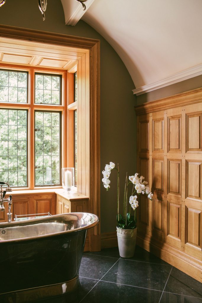 Arched classical plaster ceiling with Oak panelled walls