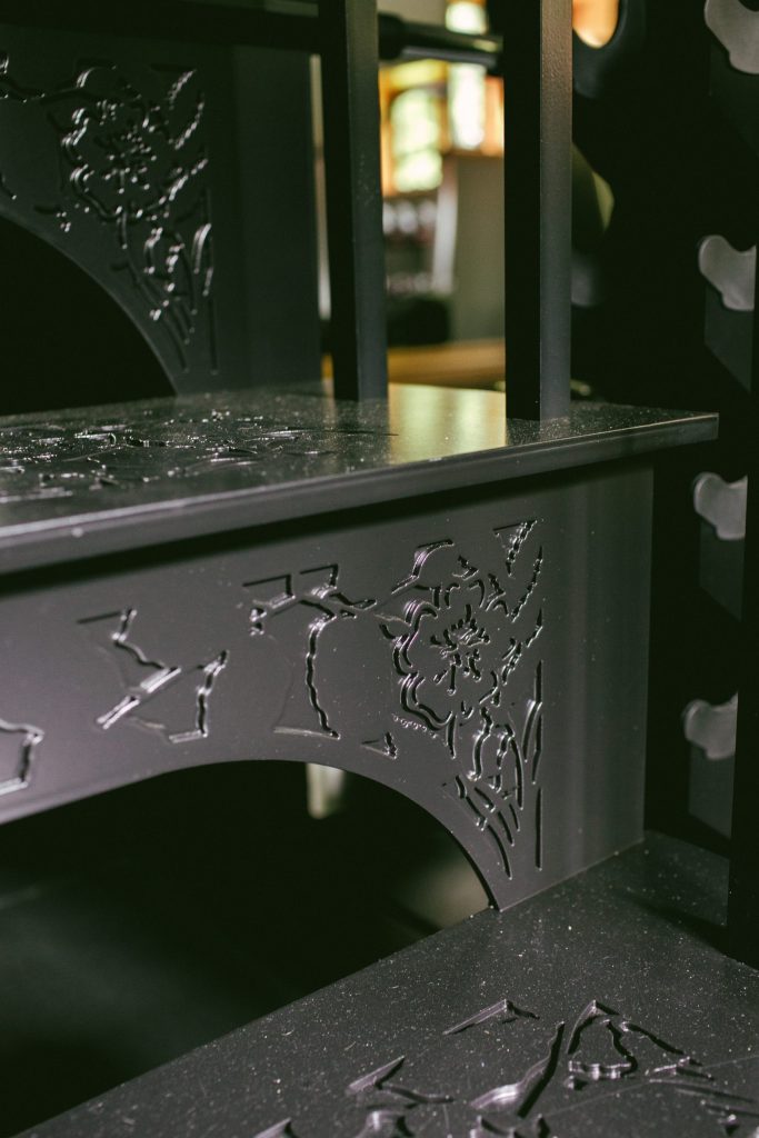 Bespoke metal staircase with decoration of leaves Bespoke metal staircase in home gym