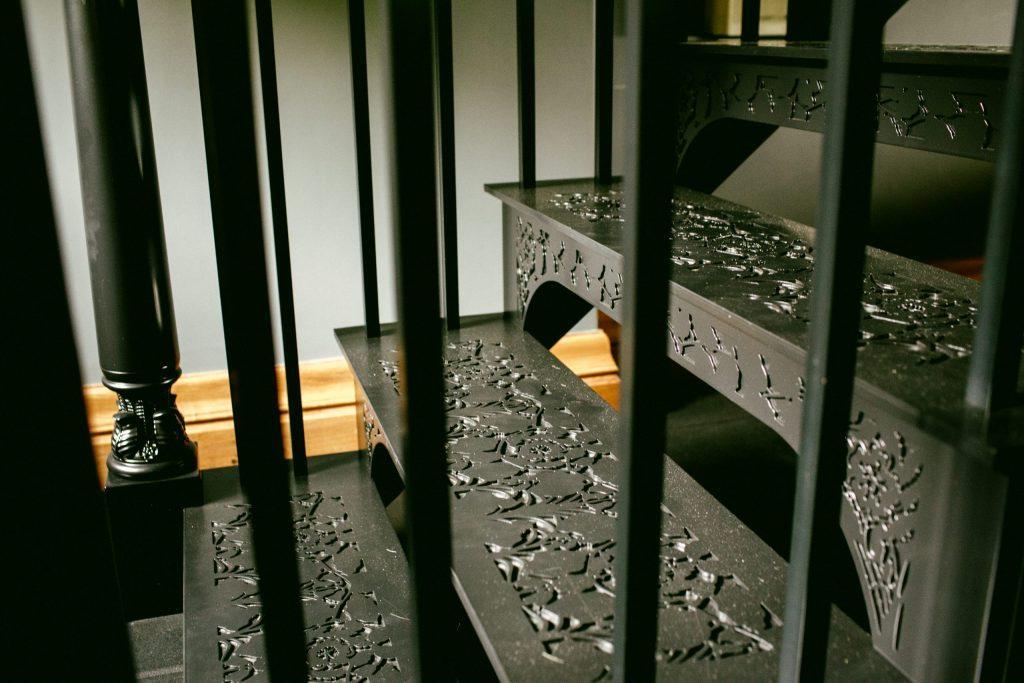 Bespoke metal staircase newel post for home gym Ornate metal staircase