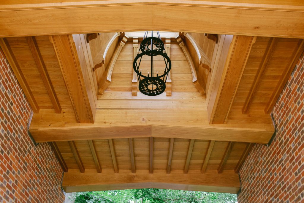 Oak Gatehouse and Outdoor Chandelier Exposed Oak beams in outdoor garden building