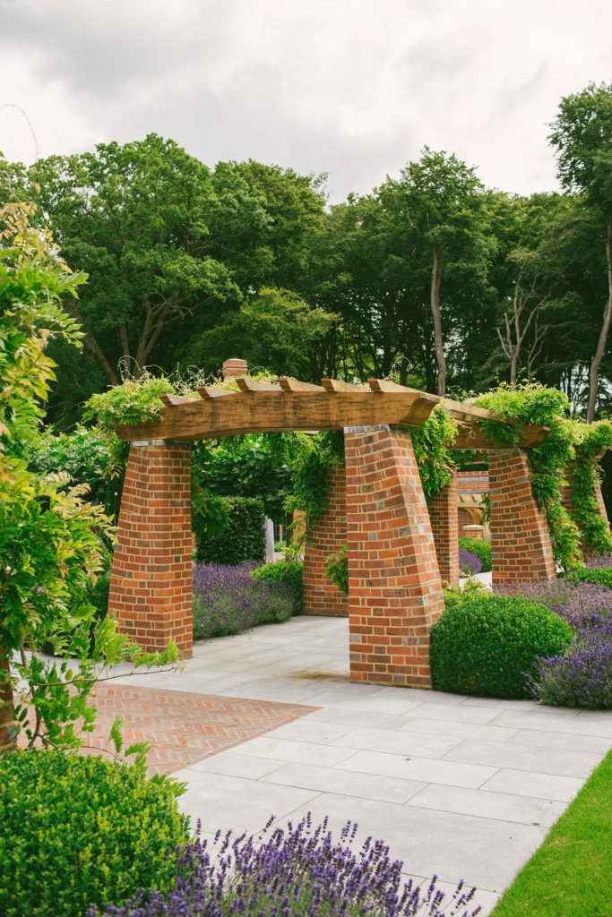 Arts and Crafts style brick and Oak loggia Arts and Crafts style garden structure