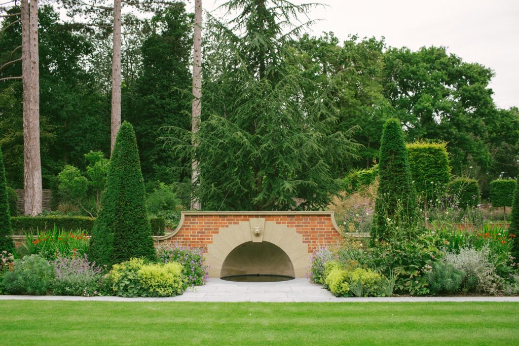 Classical stone arched fountain and pool