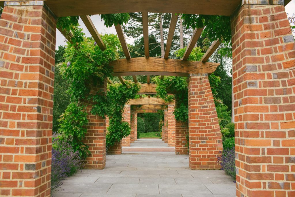 Brick and Oak garden pergola in Arts and Crafts garden