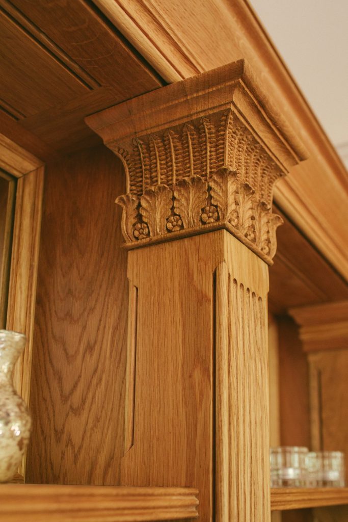 Classical Oak carving on fitted cabinet