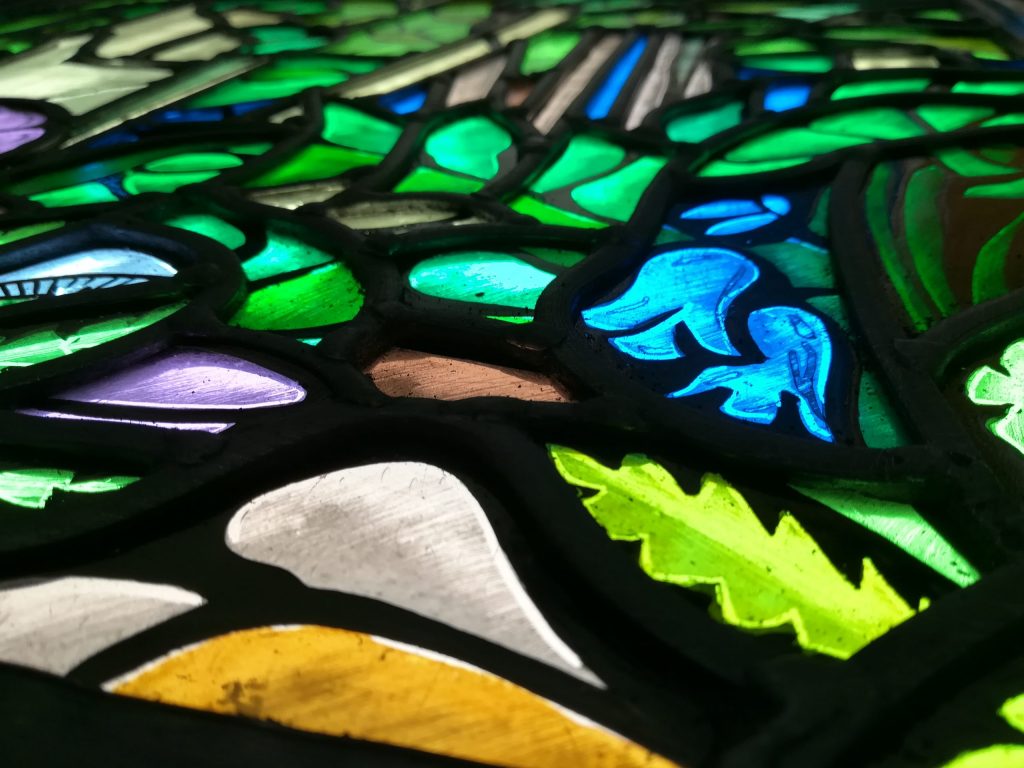 Stained glass window with bluebells