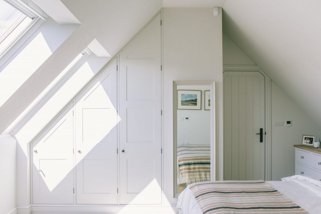 Classic contemporary built in wardrobes in loft room