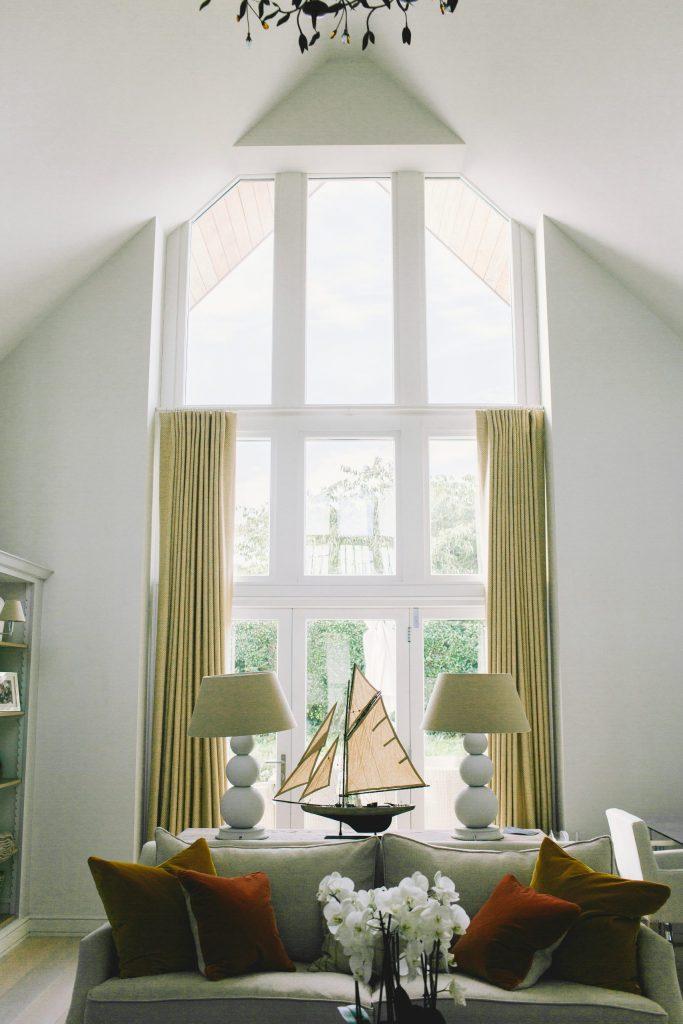 Double height south facing windows in modern seaside home