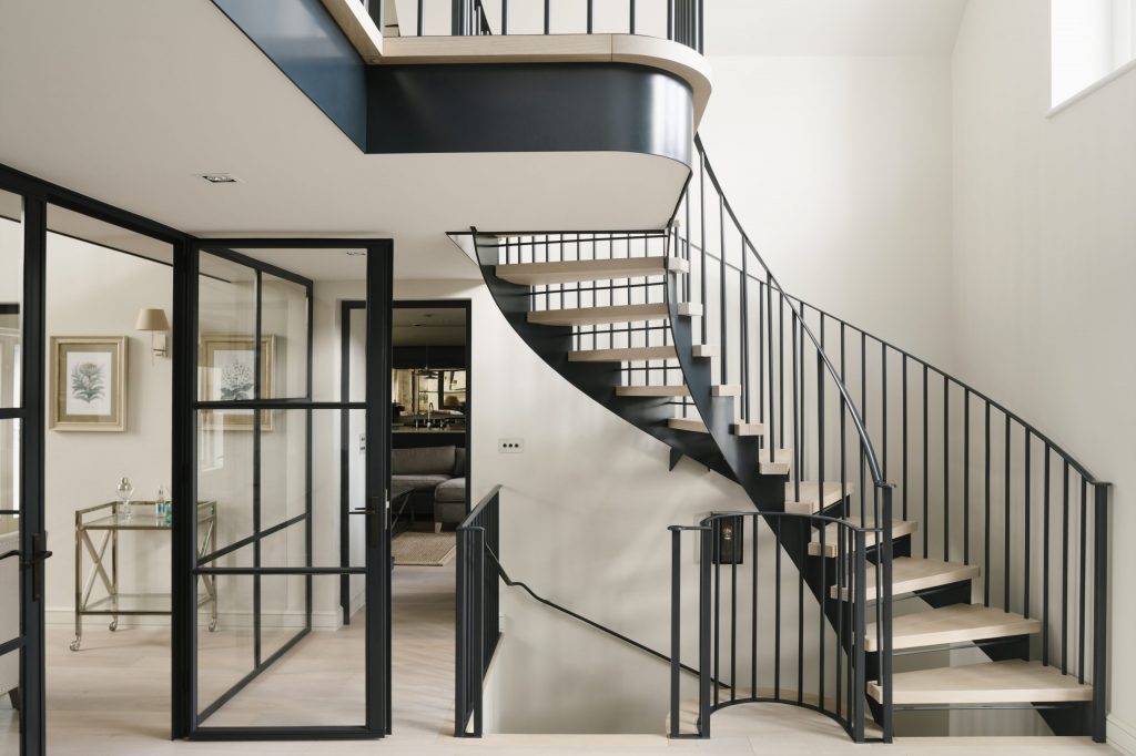 Metal and Oak curved staircase and balcony Modern metal and glass doors with matching staircase