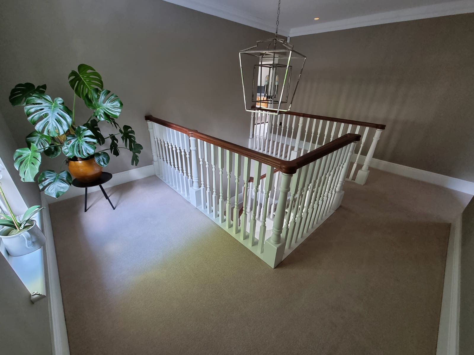 Country house stairwell landing and traditional balustrade