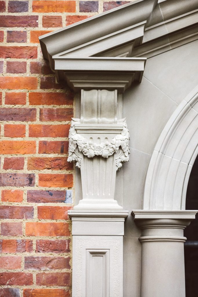 Stone carved floral swag on classical garden building