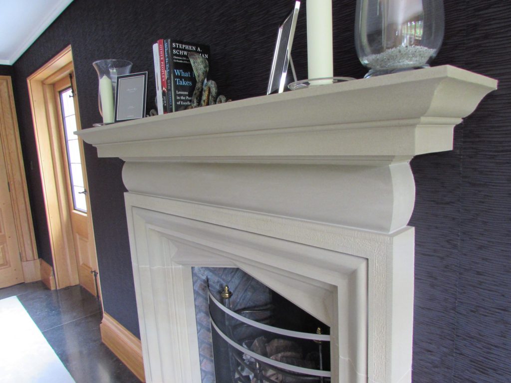 Arts and Crafts stone fireplace in English Manor House