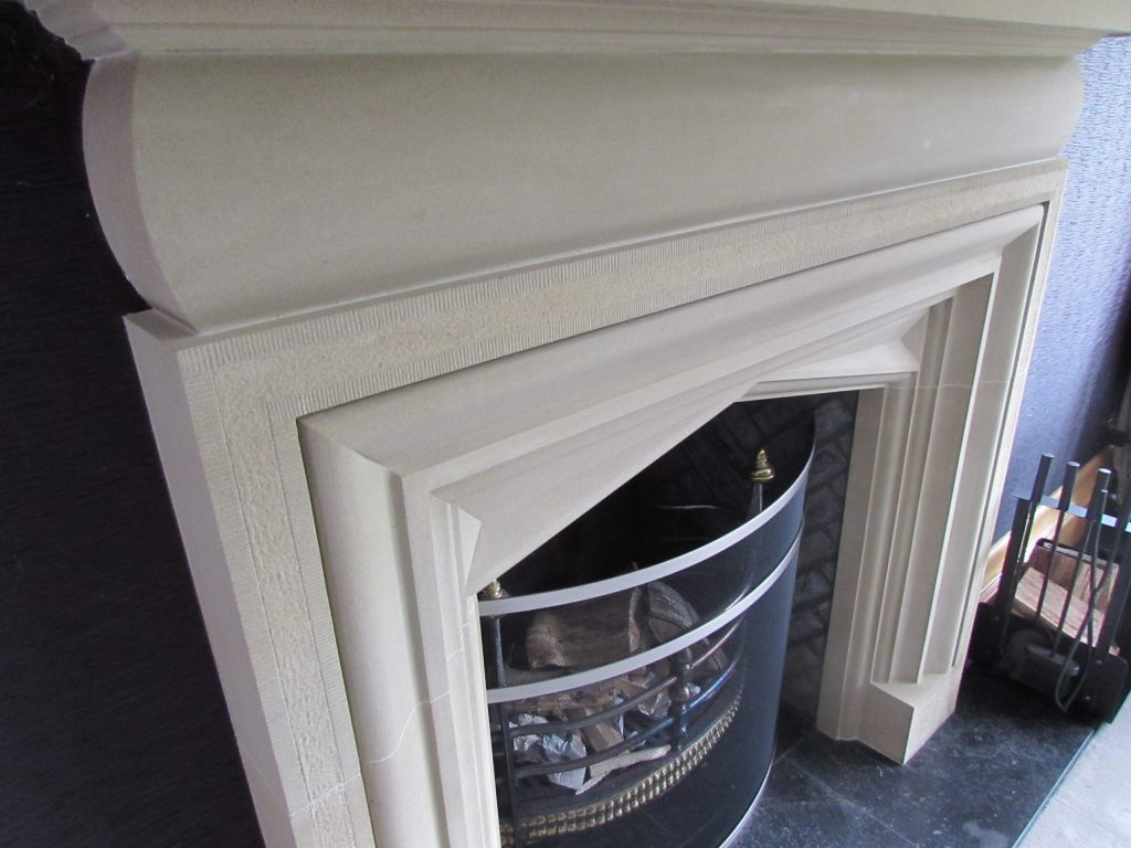 Stone carved fireplace surround in country manor Country house traditional stone fireplace