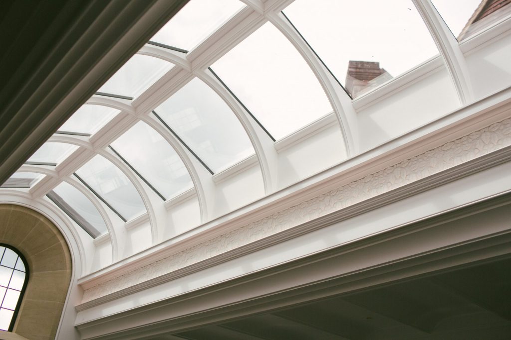 Classical orangery glass roof with plasterwork decoration