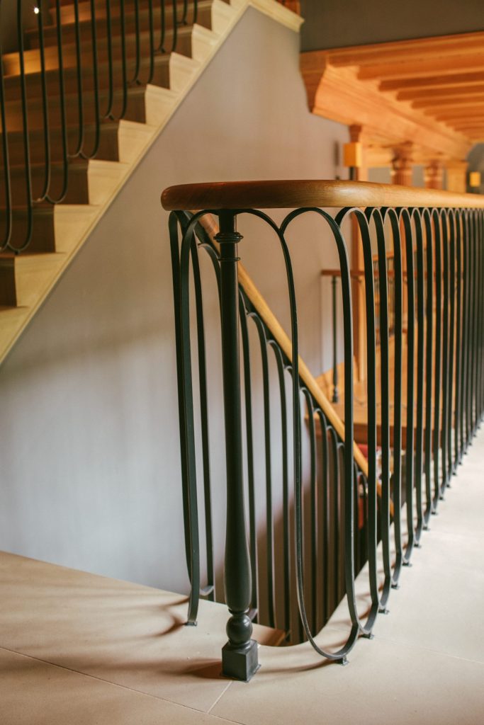 Bespoke stone staircase with metal and Oak handrail