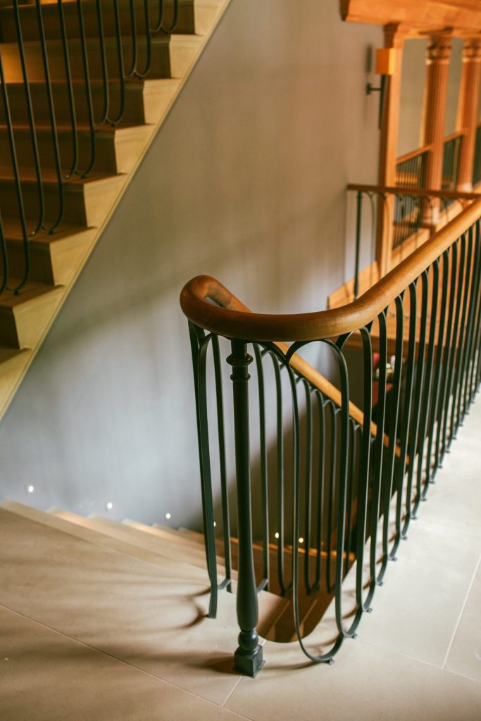 Bespoke metal and Oak handrail for staircase Country house bespoke staircase in stone and metal