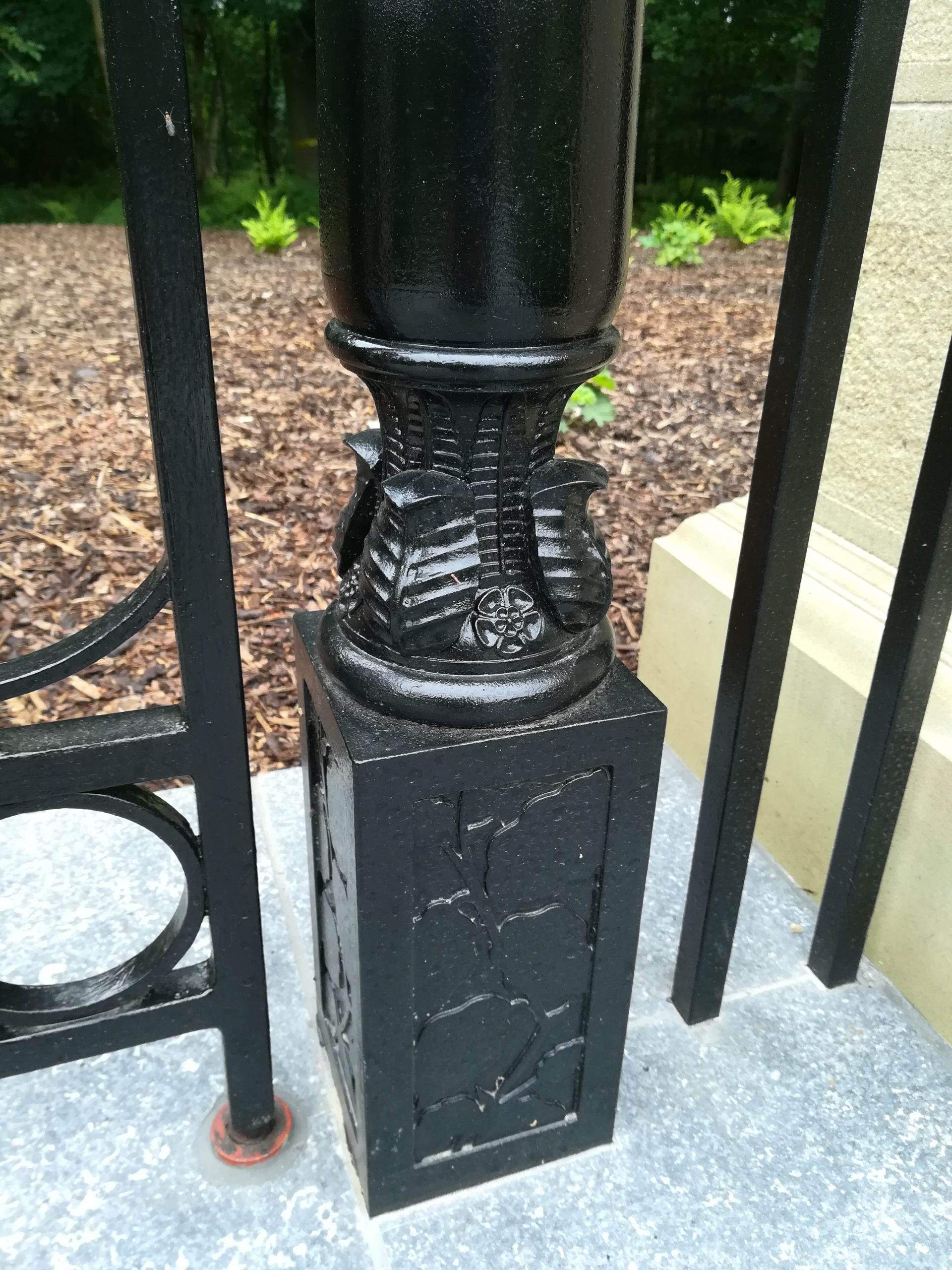 Metal garden gate newel post with leaves and flowers Post in Arts and Crafts garden