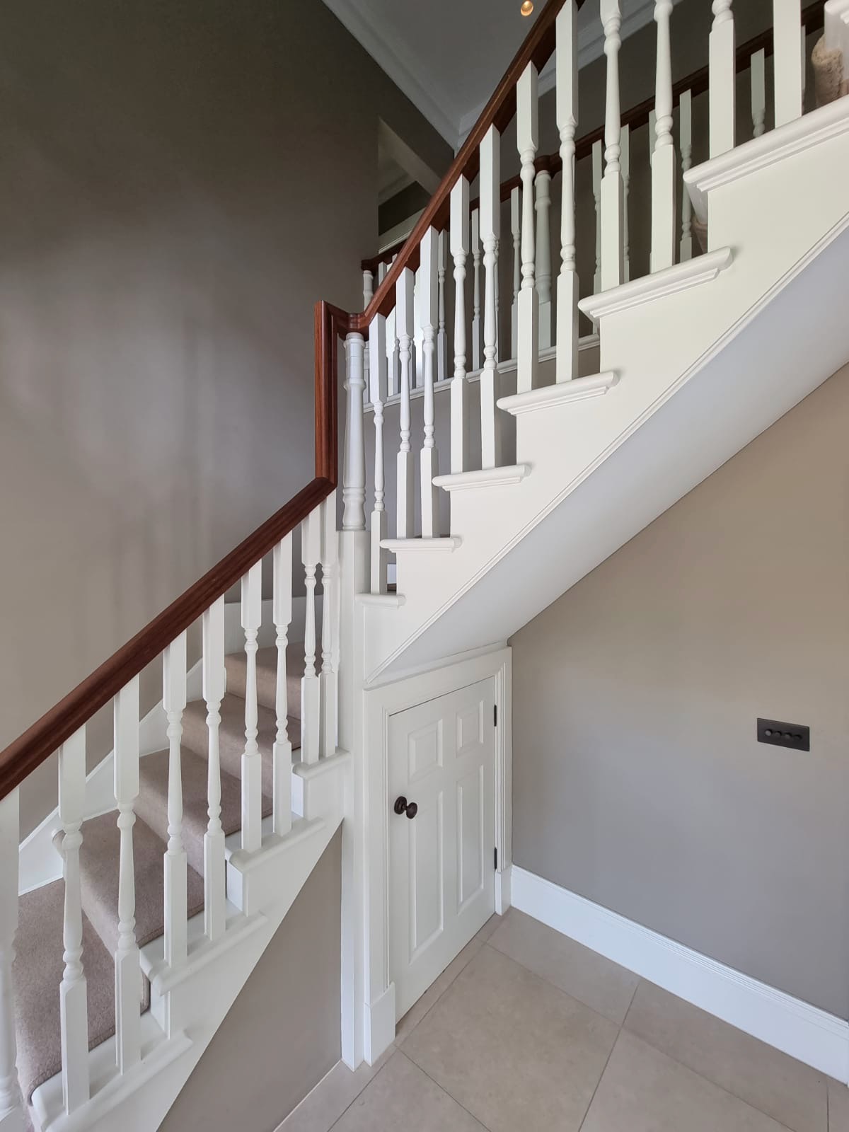 Timber staircase in hallway of large country house