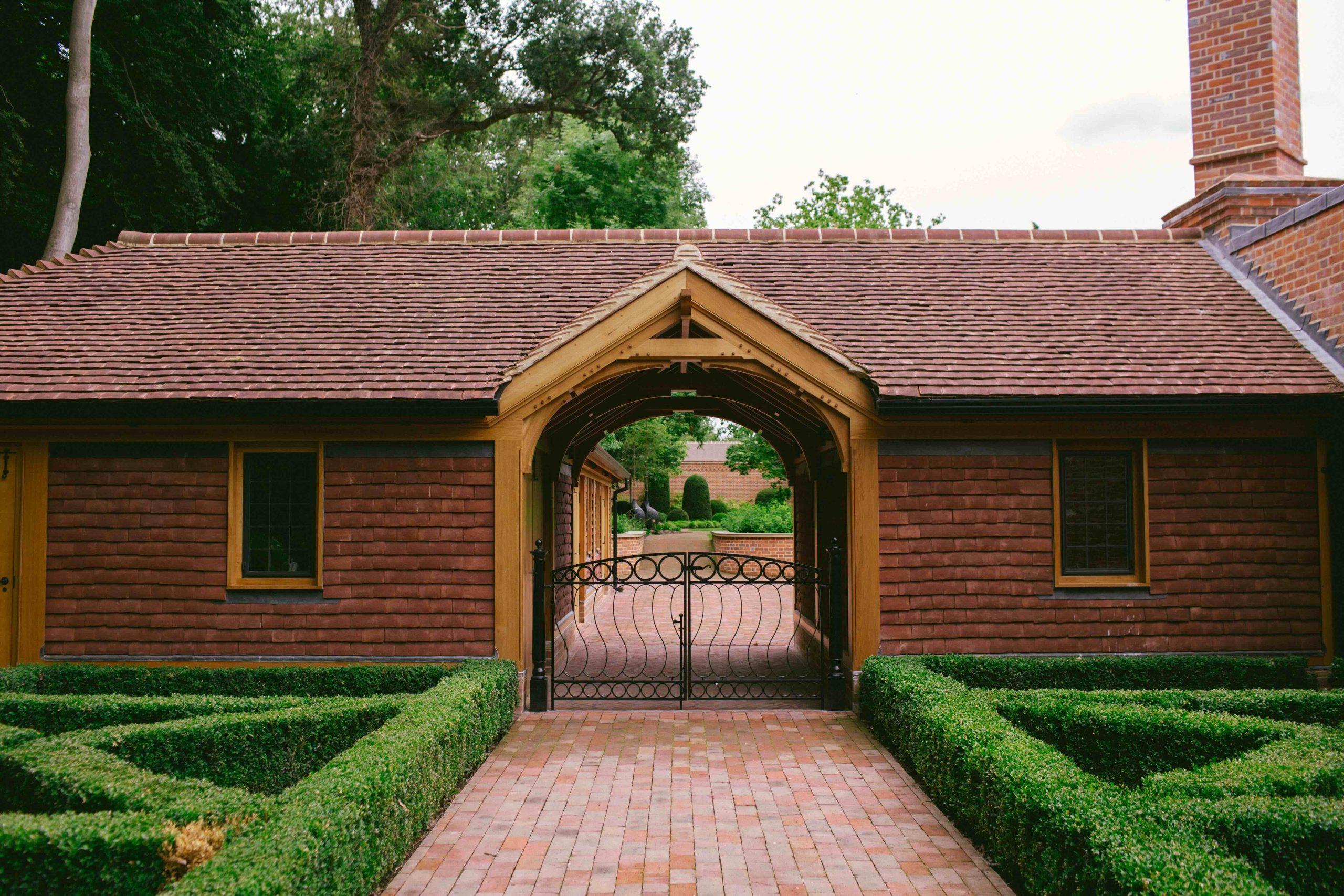 Arts and Crafts courtyard garden design and stables