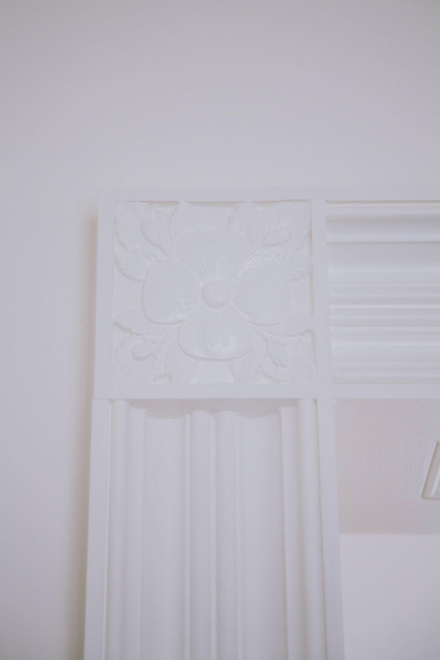 Stone carved floral swag on classical garden building