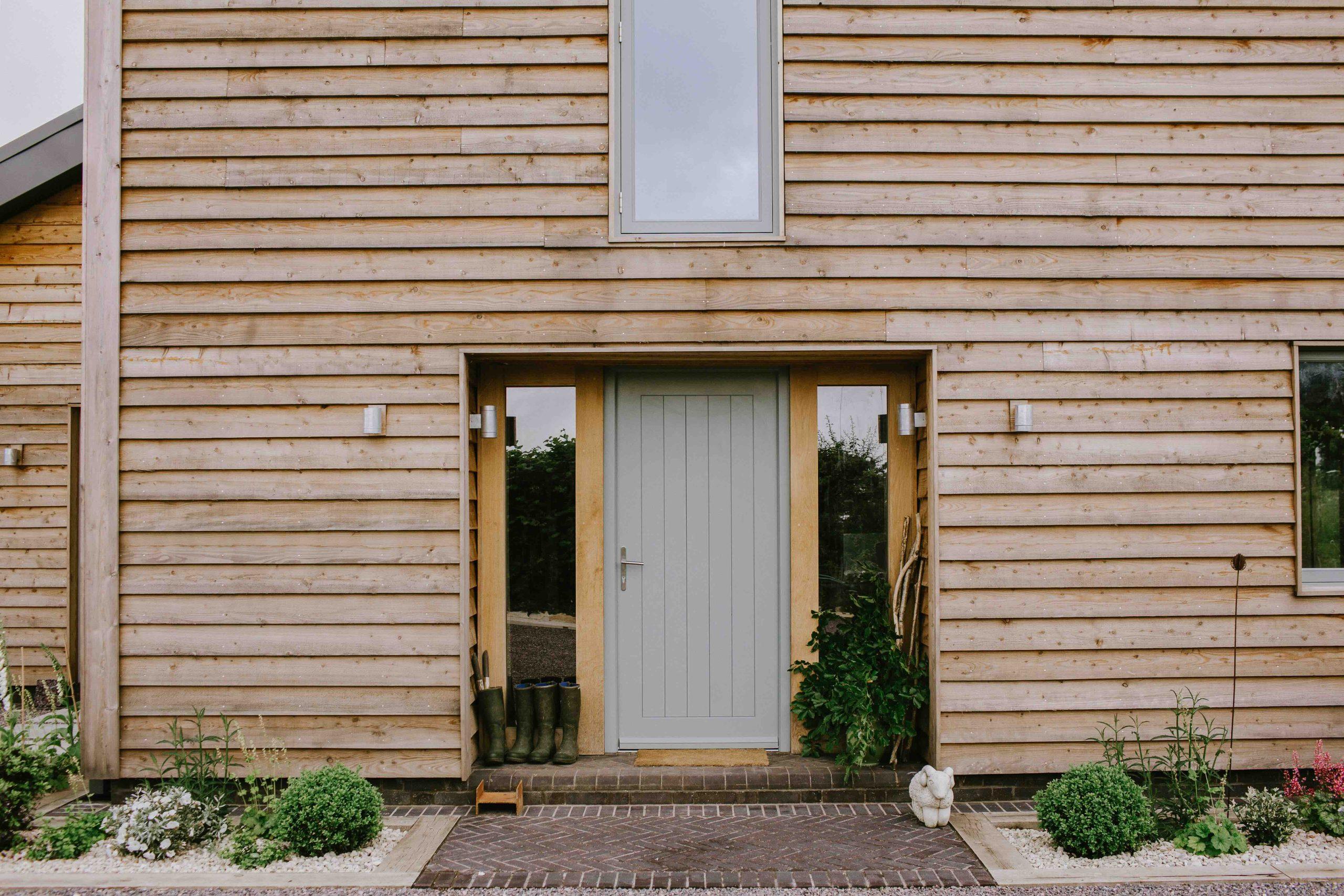 Ornate metal outdoor chandelier and Oak truss ceiling