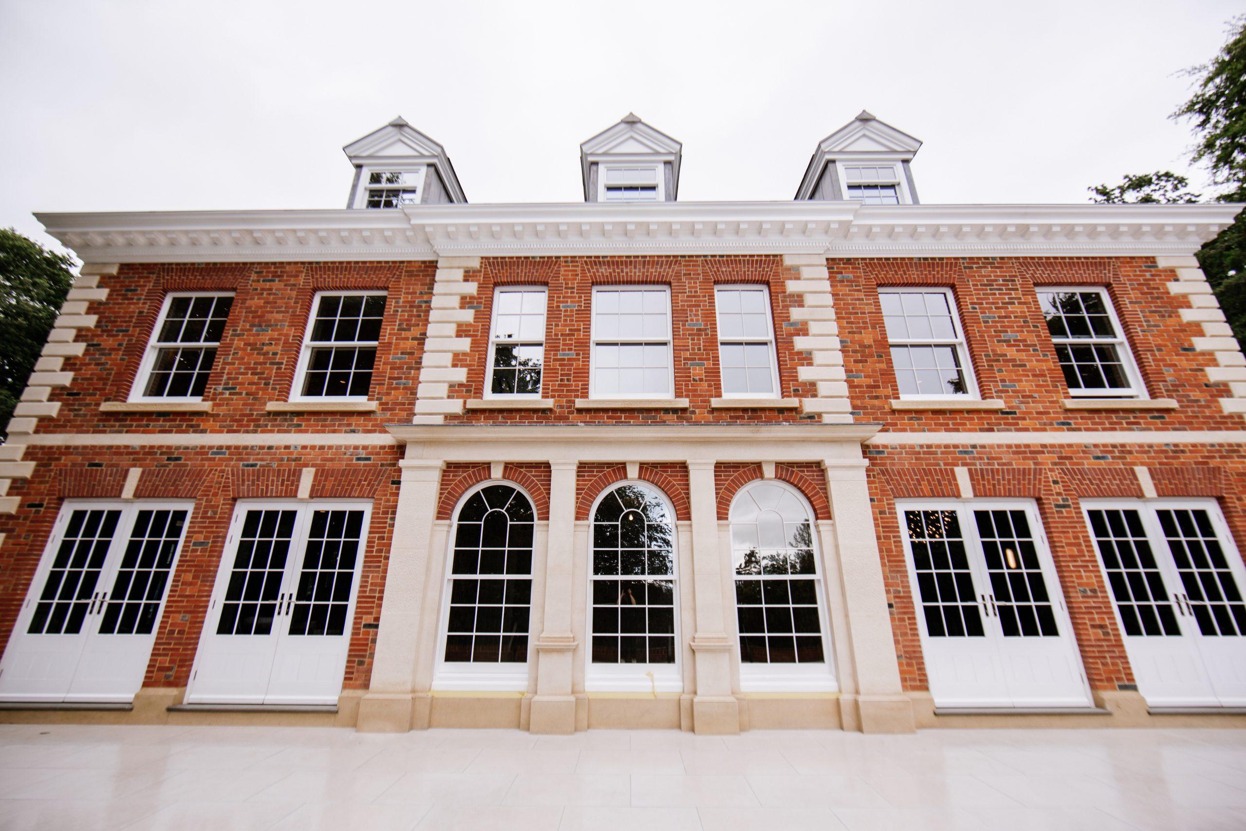 A watercolour of the East elevation to an Arts and Crafts country house restoration and remodelling project in the Quantocks. Painted by Jonathan Lees.