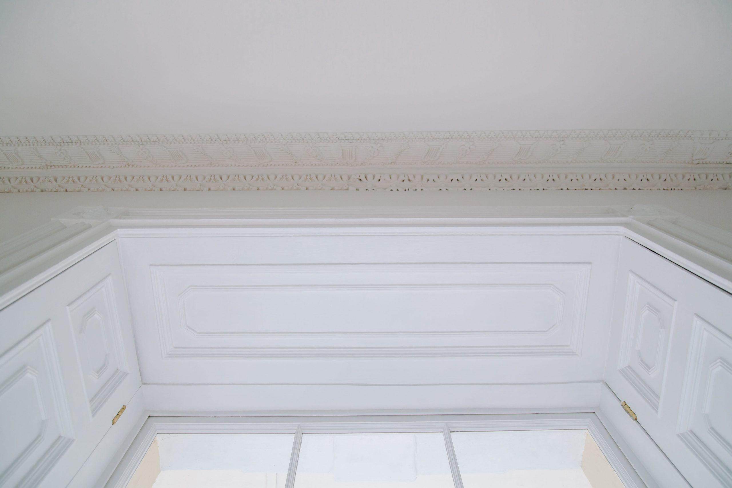 Stone carved floral swag on classical garden building