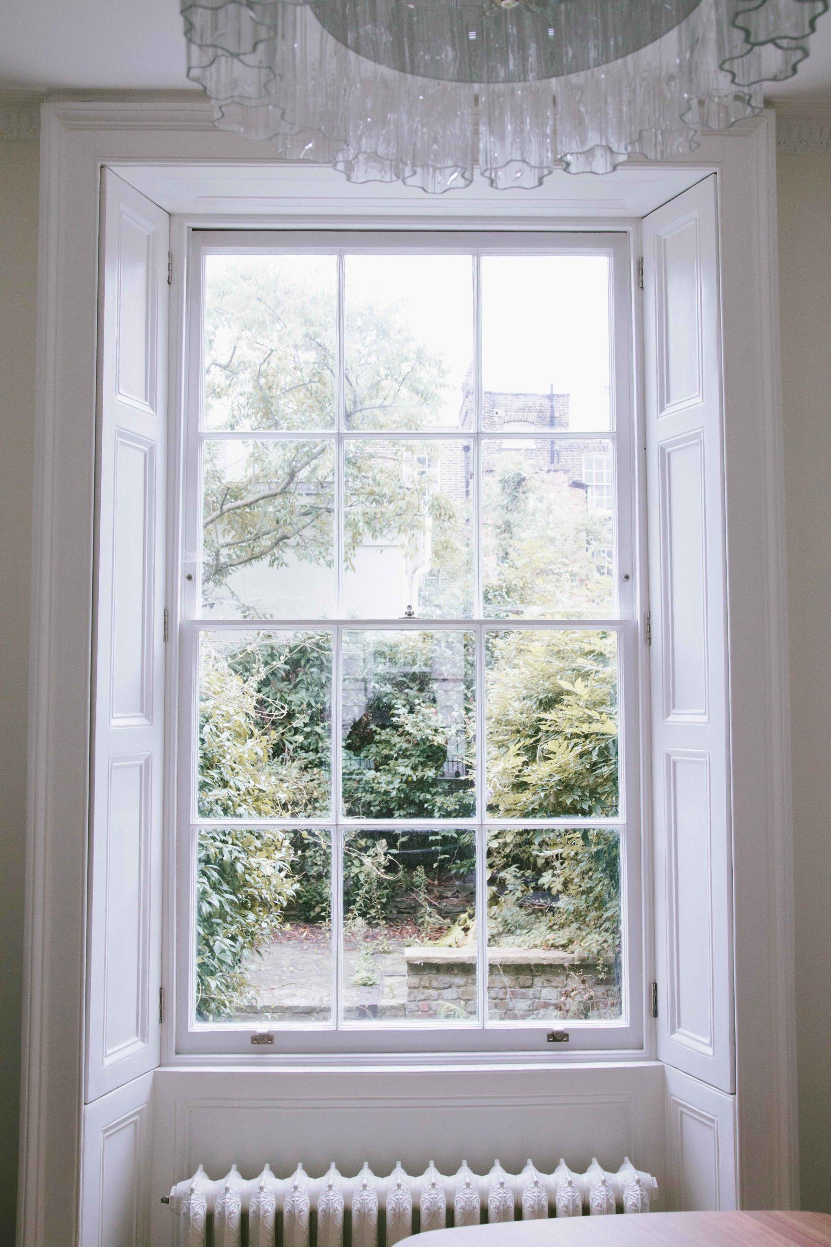 Stone carved floral swag on classical garden building