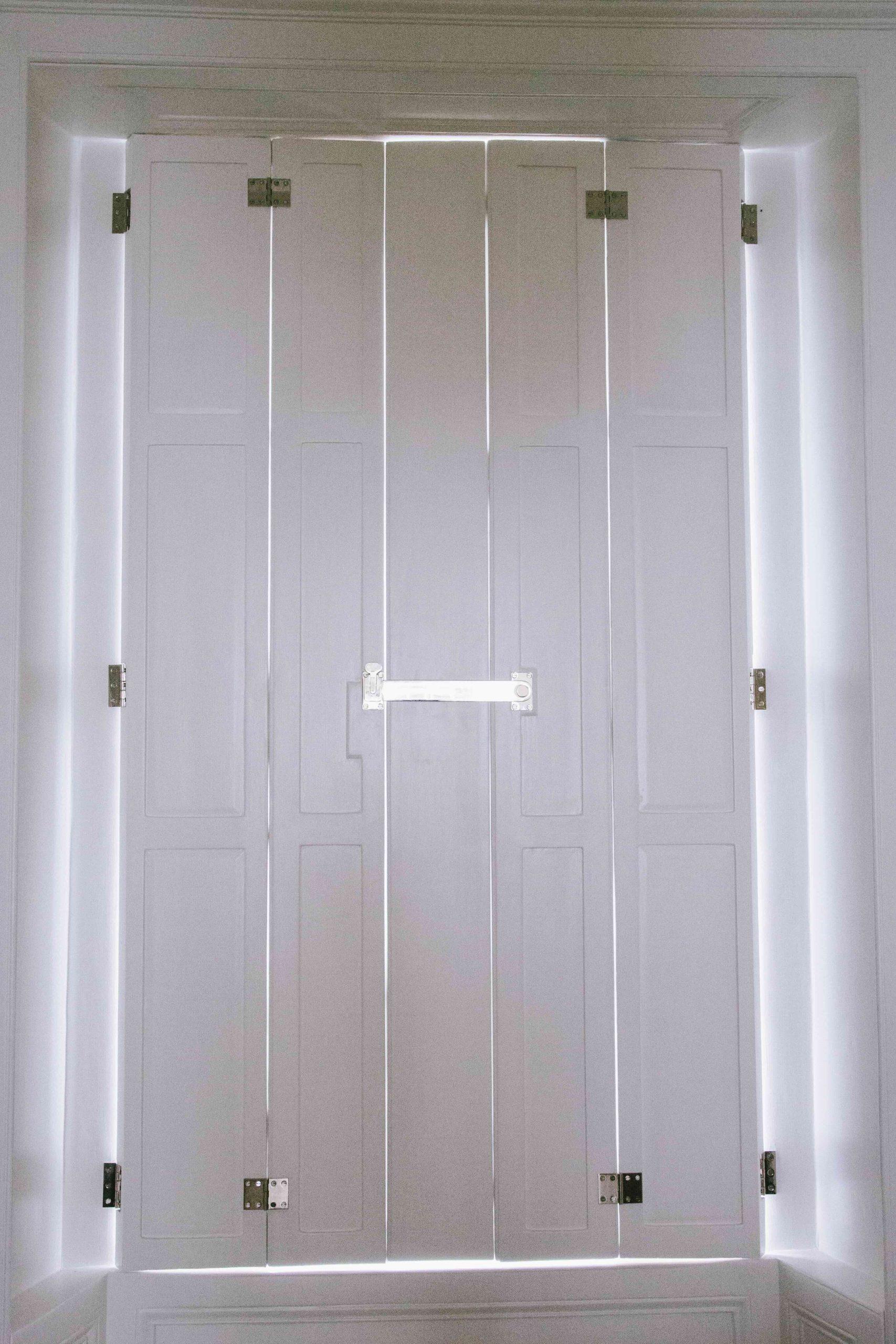 Stone carved floral swag on classical garden building