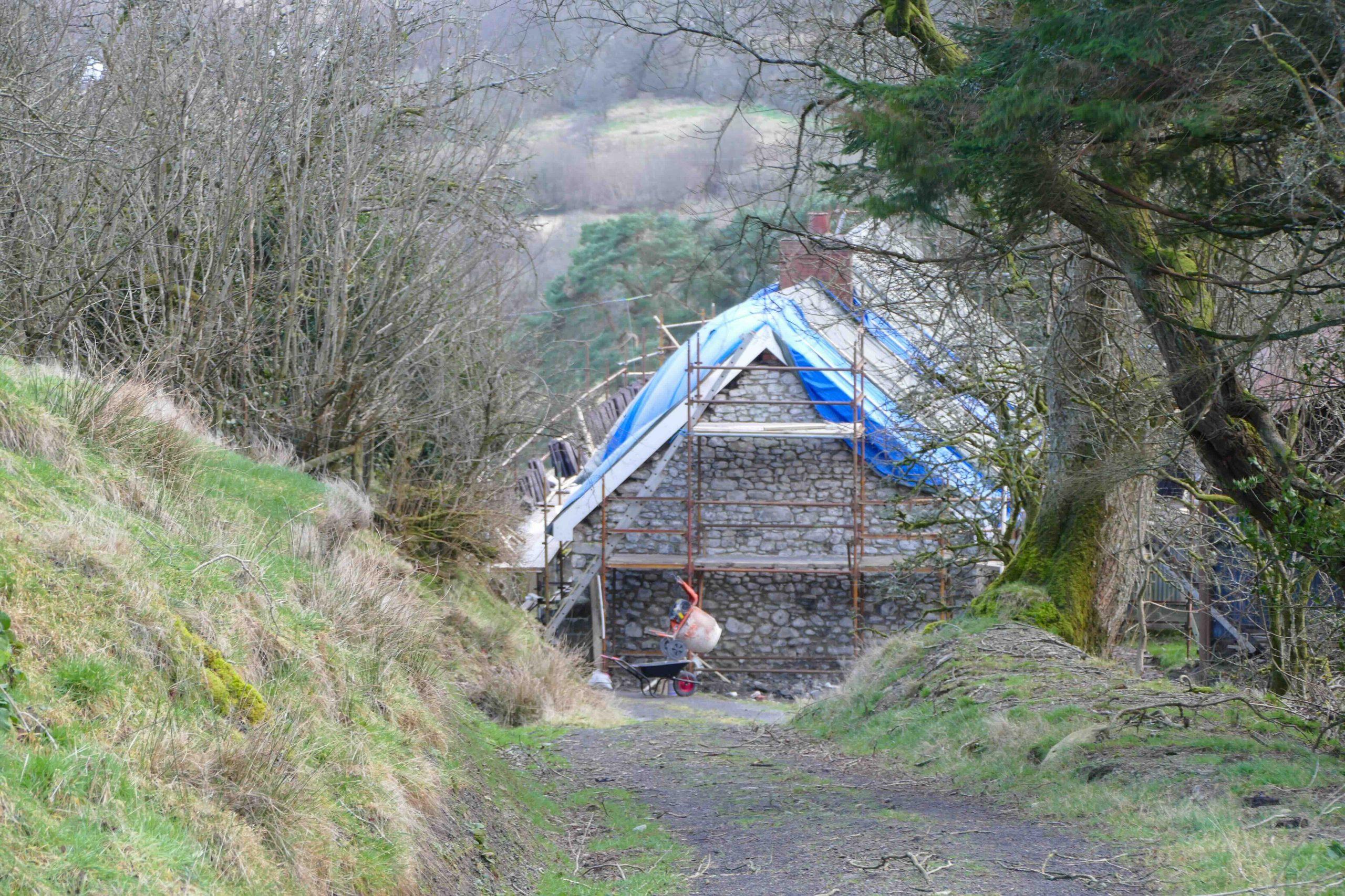 A shot down the driveway towards the restoration of a Welsh farmhouse.