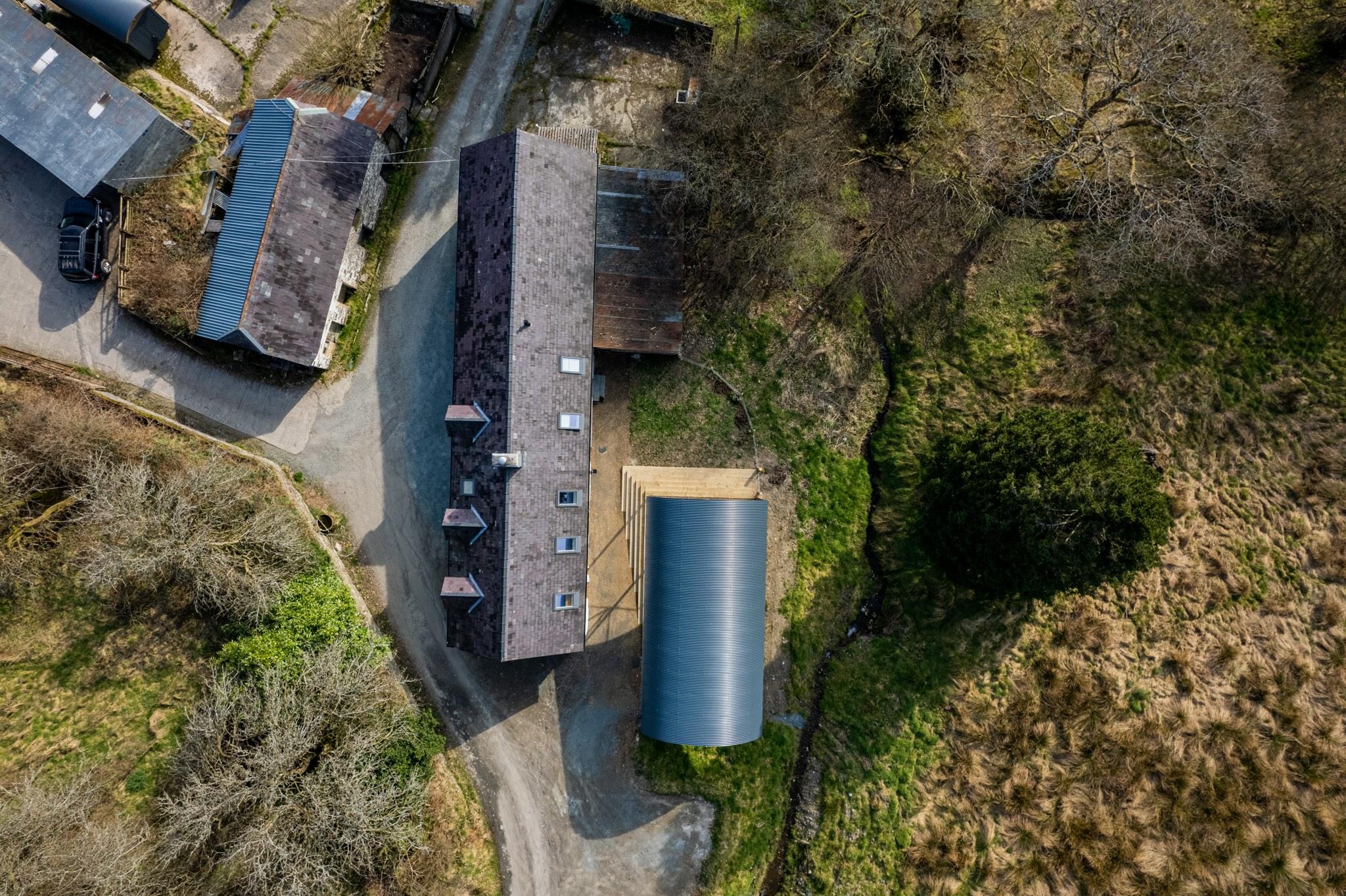 Aerial view of the renovated historic farmhouse in Mid-Wales.
